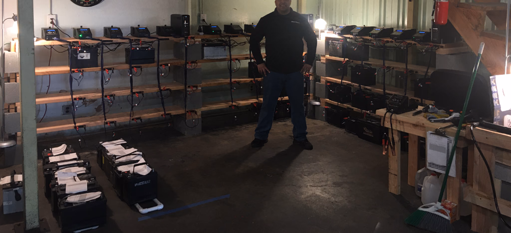 The same reconditioning shelves loaded with batteries and ready for use